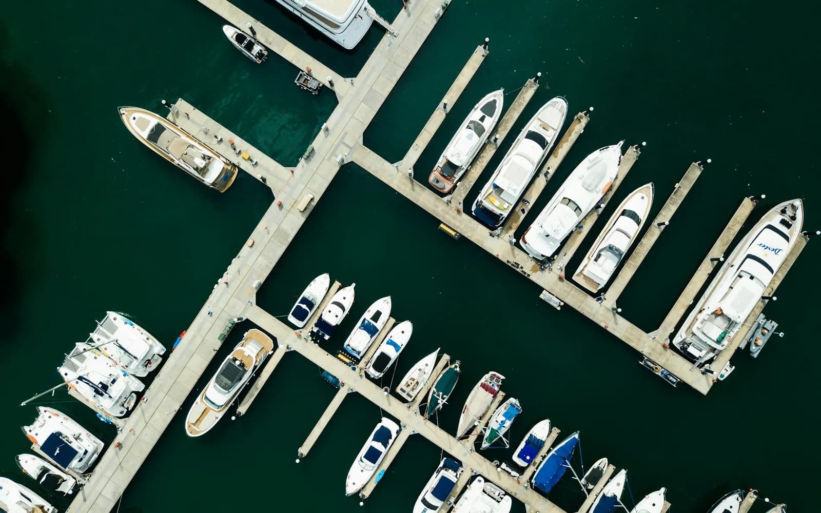 Aerial view of boats beside marina piers